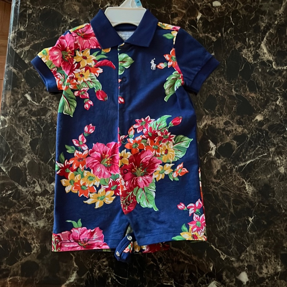 Navy blue Ralph Lauren romper with floral print. New without tags, never worn